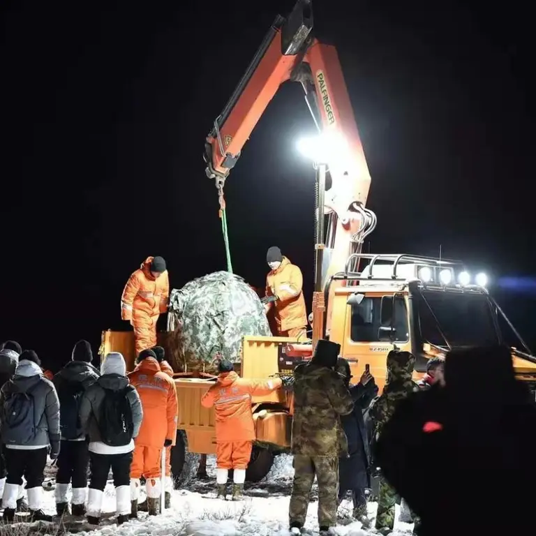 Change-5 lunar mission return capsule lifted by Palfinger crane